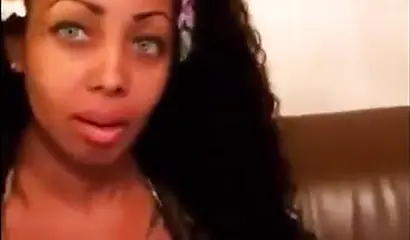 Black chick with implants shows her massive titties and loves the feeling of it