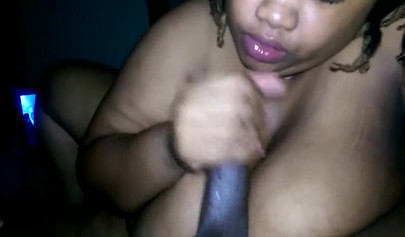 Fat ebony chick swirls her tongue around a fat dick and gives a good blowjob