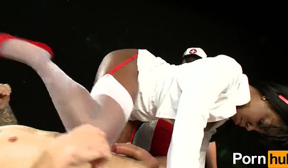 Two black nurses takes turns licking on white dudes cock and he loves it a lot