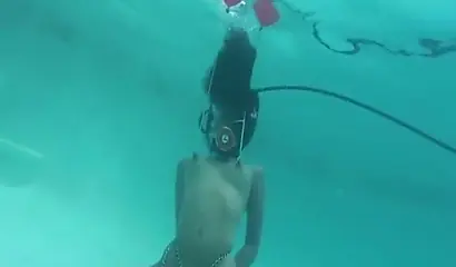 Skinny ebony vixen is hogtied underwater and exposed completely naked for cam