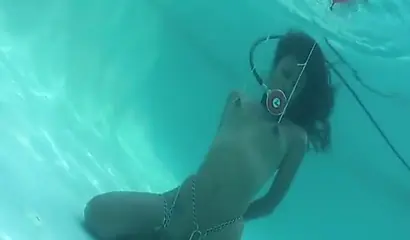 Skinny ebony vixen is hogtied underwater and exposed completely naked for cam