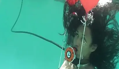 Skinny ebony vixen is hogtied underwater and exposed completely naked for cam