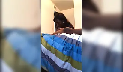 Dashing ebony teenie gives a long and sloppy erotic blowjob to a big black cock