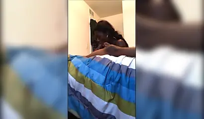 Dashing ebony teenie gives a long and sloppy erotic blowjob to a big black cock