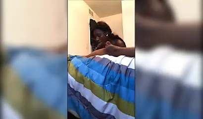 Dashing ebony teenie gives a long and sloppy erotic blowjob to a big black cock