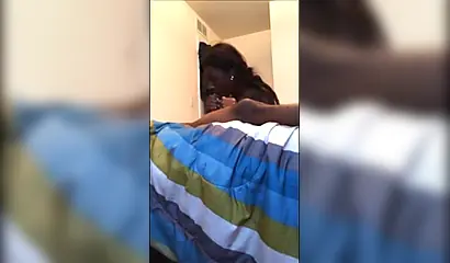 Dashing ebony teenie gives a long and sloppy erotic blowjob to a big black cock