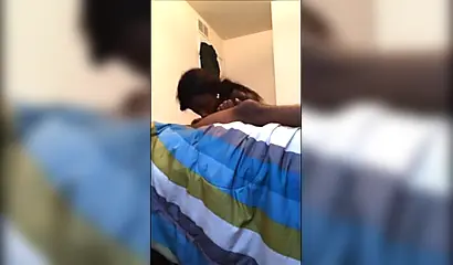 Dashing ebony teenie gives a long and sloppy erotic blowjob to a big black cock