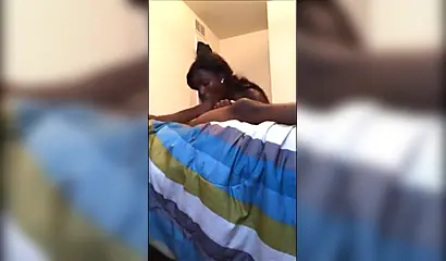 Dashing ebony teenie gives a long and sloppy erotic blowjob to a big black cock