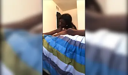 Dashing ebony teenie gives a long and sloppy erotic blowjob to a big black cock