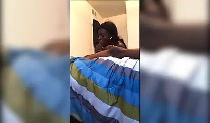 Dashing ebony teenie gives a long and sloppy erotic blowjob to a big black cock