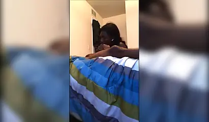 Dashing ebony teenie gives a long and sloppy erotic blowjob to a big black cock