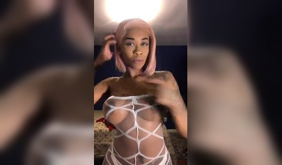 Dashing ebony Instagram model with pink hair teases with her perfect tattooed body