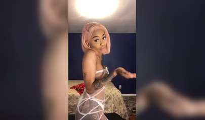 Dashing ebony Instagram model with pink hair teases with her perfect tattooed body
