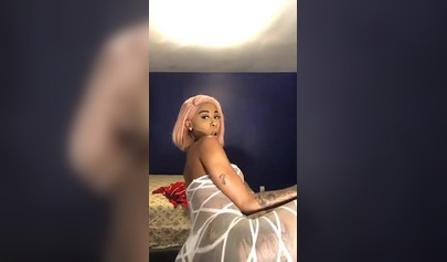 Dashing ebony Instagram model with pink hair teases with her perfect tattooed body