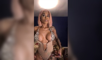 Dashing ebony Instagram model with pink hair teases with her perfect tattooed body