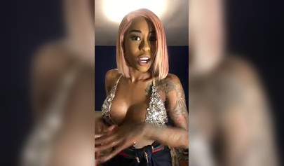 Dashing ebony Instagram model with pink hair teases with her perfect tattooed body