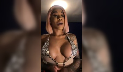 Dashing ebony Instagram model with pink hair teases with her perfect tattooed body