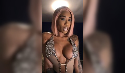 Dashing ebony Instagram model with pink hair teases with her perfect tattooed body