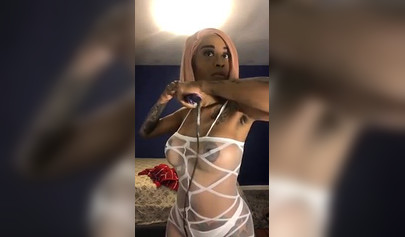 Dashing ebony Instagram model with pink hair teases with her perfect tattooed body