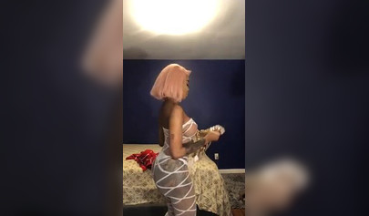 Dashing ebony Instagram model with pink hair teases with her perfect tattooed body