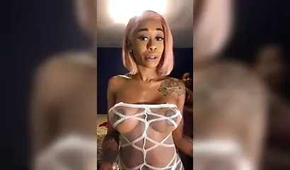 Dashing ebony Instagram model with pink hair teases with her perfect tattooed body