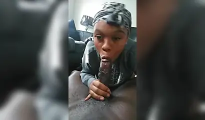 Luscious ebony babe pleasures a big black cock with a long and sloppy blowjob