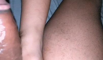 Pregnant black amateur gives her man a handjob and a footjob while masturbating