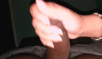 Pregnant black amateur gives her man a handjob and a footjob while masturbating