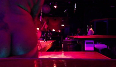 Ebony chick with massive tits and a huge belly dances in an empty strip club