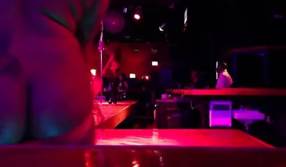 Ebony chick with massive tits and a huge belly dances in an empty strip club
