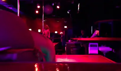 Ebony chick with massive tits and a huge belly dances in an empty strip club