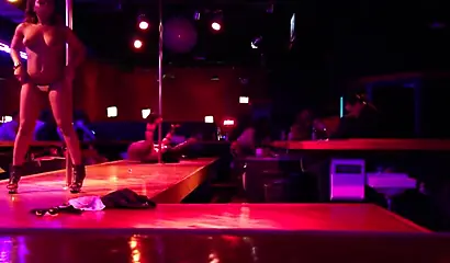 Ebony chick with massive tits and a huge belly dances in an empty strip club