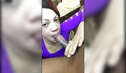 Ebony MILF gives a good and a sloppy blowjob to a young guy with a big dick