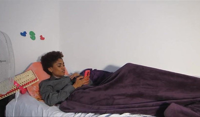 Skinny ebony chick with curly hair pleases herself with her fingers and a dildo