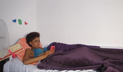 Skinny ebony chick with curly hair pleases herself with her fingers and a dildo