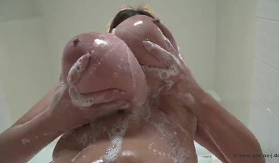 Compilation of sensual black ladies teasing by fondling their massive round tits