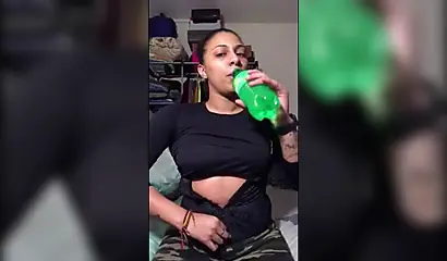 Naughty ebony teenager gives a kinky fetish performance drinking soda and burping
