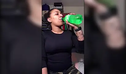 Naughty ebony teenager gives a kinky fetish performance drinking soda and burping