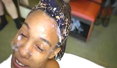 Skinny black chick fucked long and hard by two hard cocks and sprayed with cum