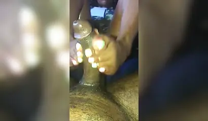 Kinky ebony chick gives a long and wet blowjob and footjob to a big black cock