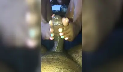 Kinky ebony chick gives a long and wet blowjob and footjob to a big black cock