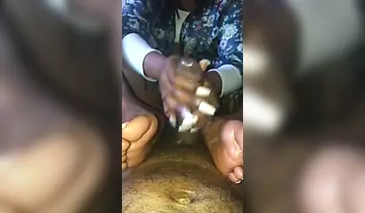 Kinky ebony chick gives a long and wet blowjob and footjob to a big black cock