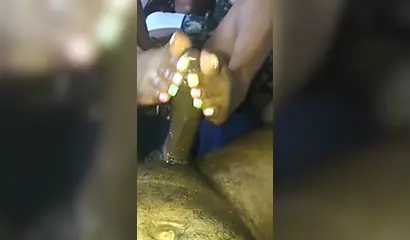 Kinky ebony chick gives a long and wet blowjob and footjob to a big black cock