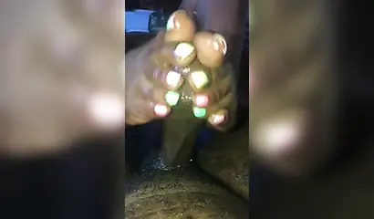 Kinky ebony chick gives a long and wet blowjob and footjob to a big black cock