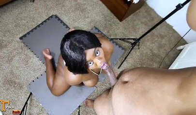 Chubby and sexy black chick gives a wet blowjob before being pounded doggy style
