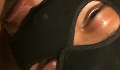 Horny and kinky masked black chick deepthroats and chokes on a massive hard dick