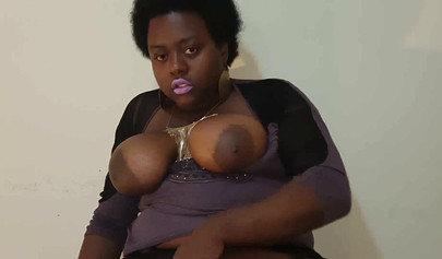 Chubby black mommy with big tits and round ass fucks her wet pussy with a dildo