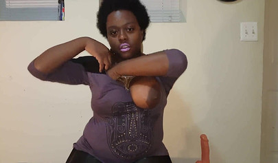 Chubby black mommy with big tits and round ass fucks her wet pussy with a dildo