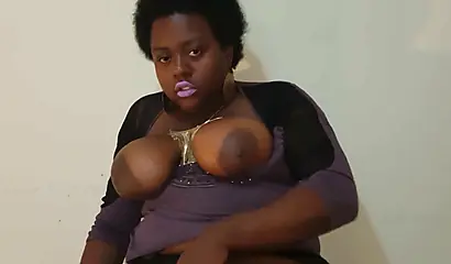 Chubby black mommy with big tits and round ass fucks her wet pussy with a dildo
