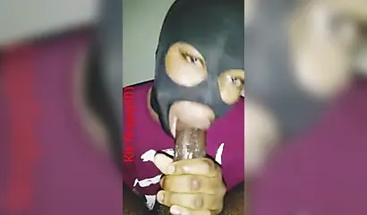 Lusty black amateur chick wears a mask and gives a long wet and sloppy blowjob